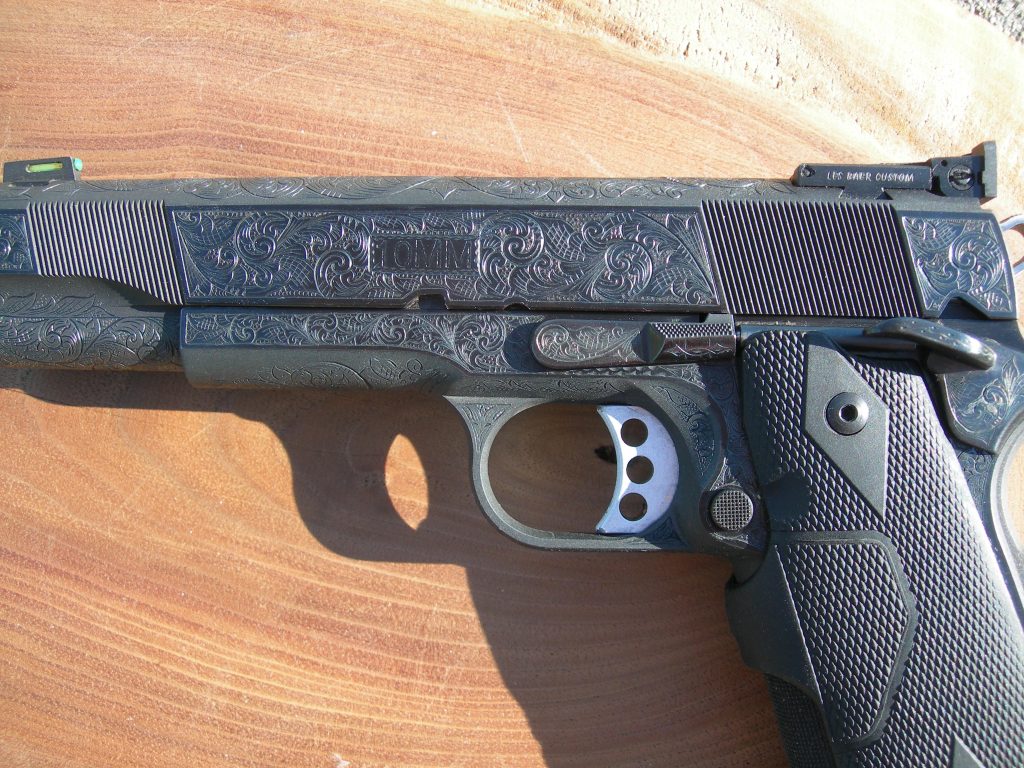 American Scroll engraving details on a Les Baer 1911 pistol.