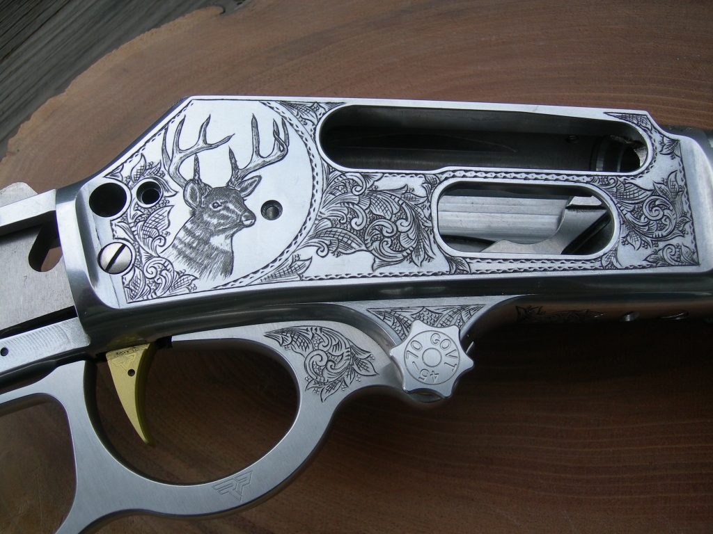 A Marlin 1895 45/70 featuring American Scrollwork and a portrait of a Whitetail deer buck.